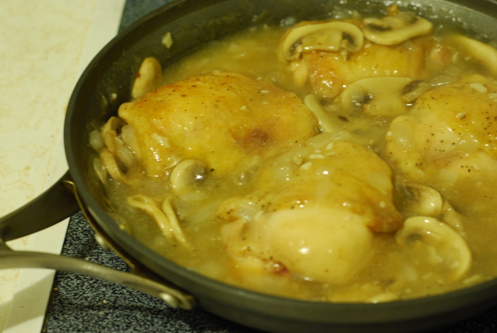 Chicken cooking in the sauce